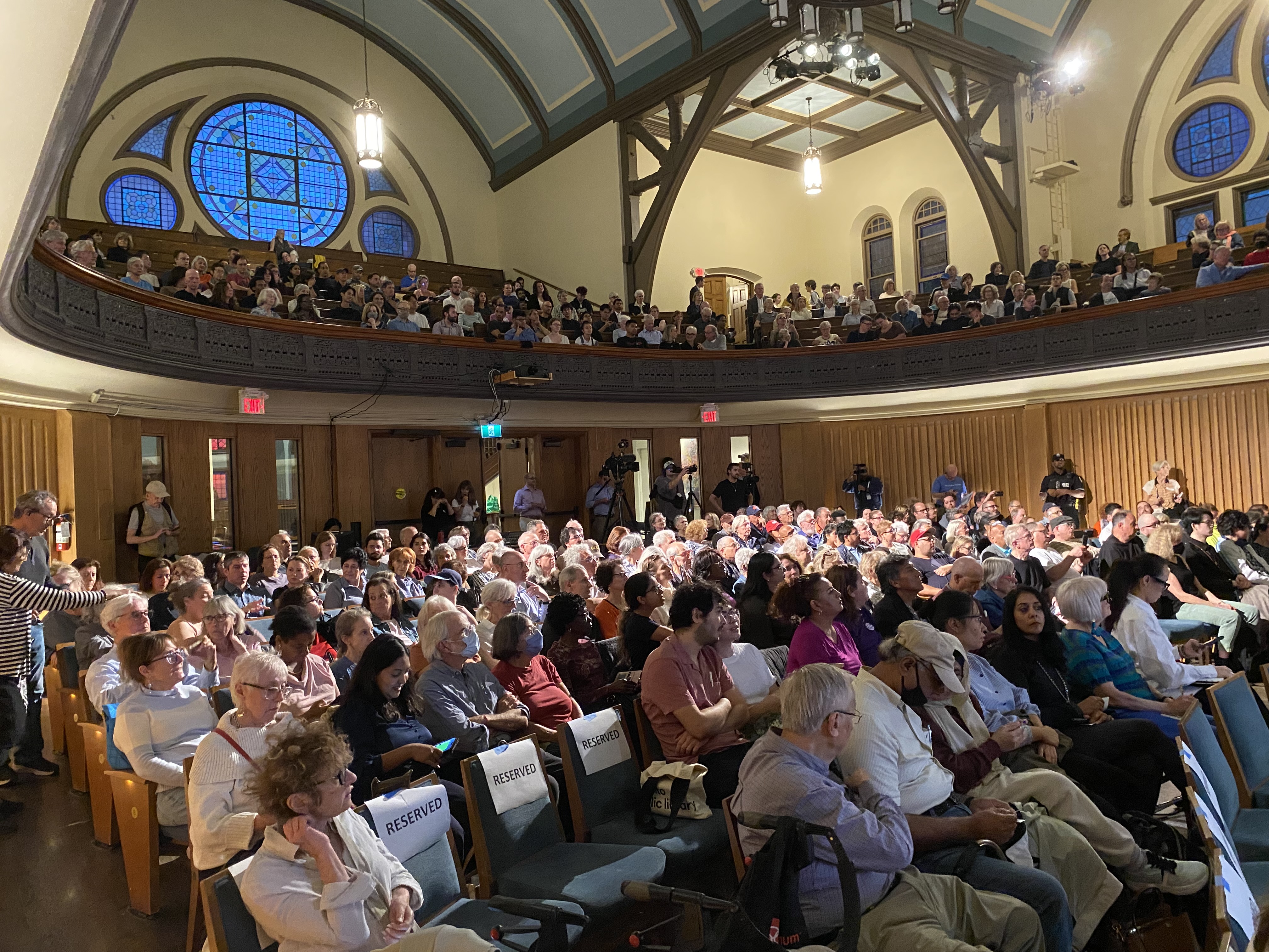 Audience members fill the main floor and balcony of Trinity-St. Paul’s United Church for the Toronto Mayoral Debate.